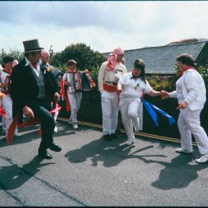 Master of Ceremonies dancing with women in procession