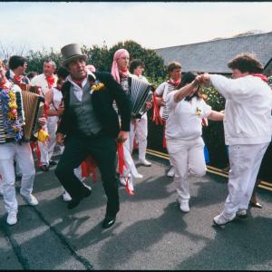 Master of Ceremonies dancing with women in procession