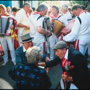 Old Oss Master of Ceremonies knelt down amongst crowd