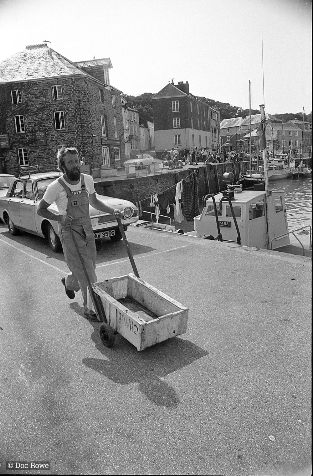 Taffy Thomas pushing cart on harbourside