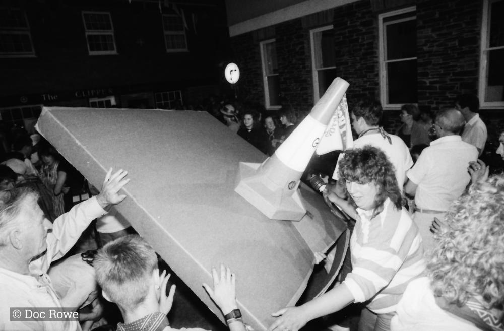 people teasing makeshift oss at night