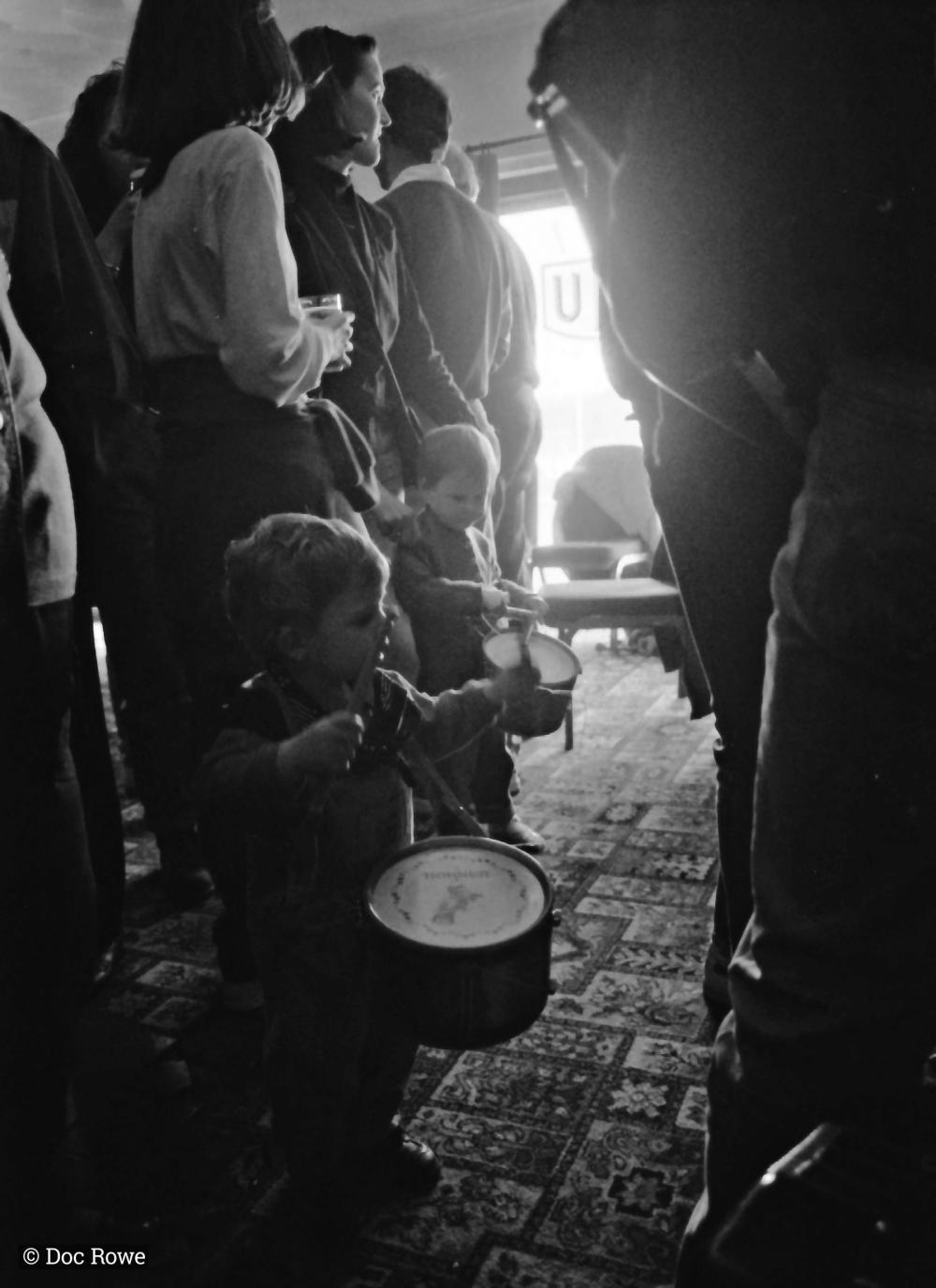 children playing drums in pub