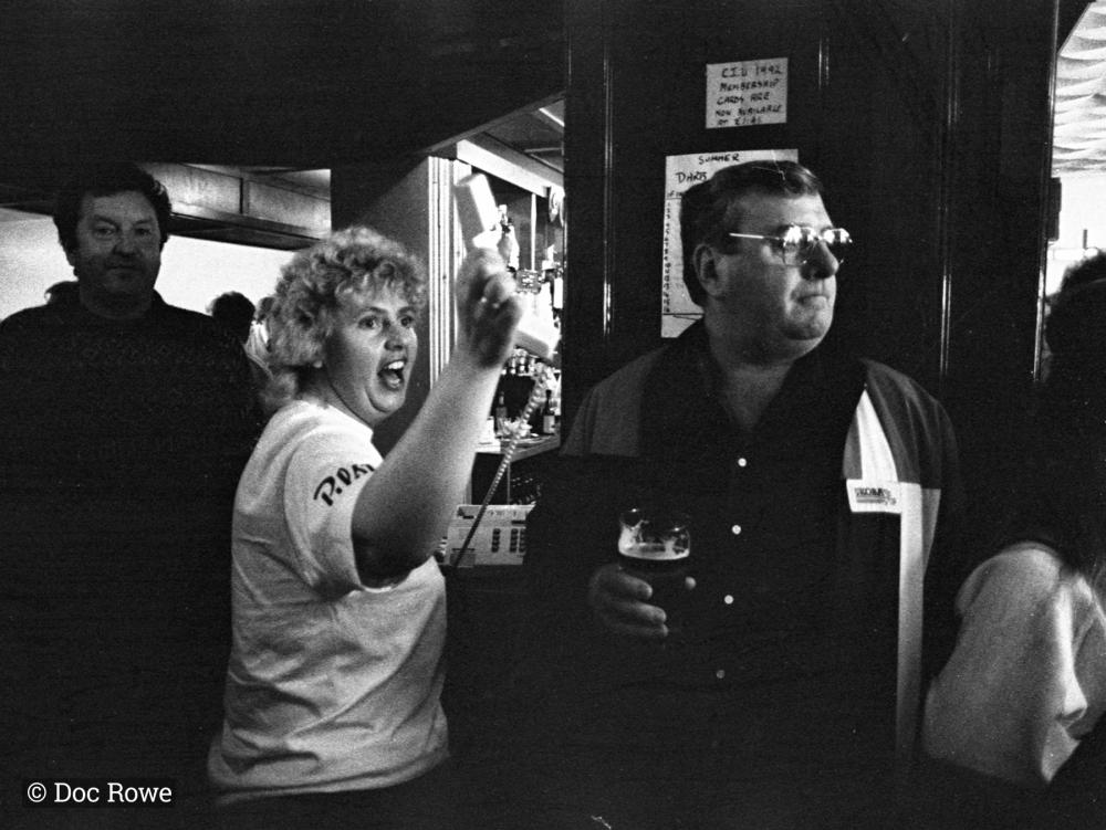 Woman with telephone in pub
