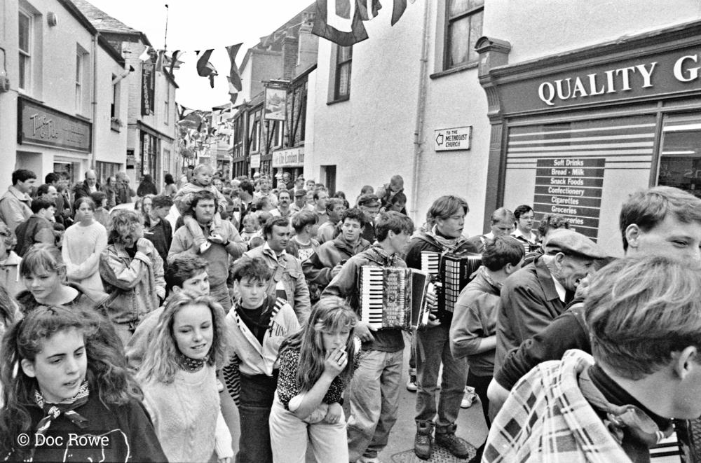 People in procession in street