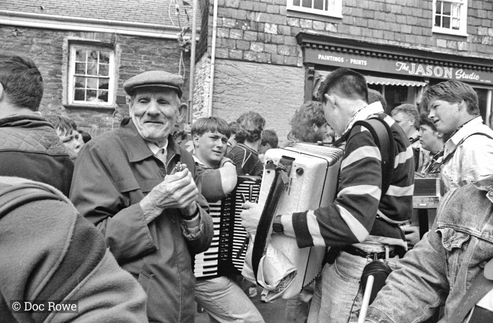 People playing music in procession in street