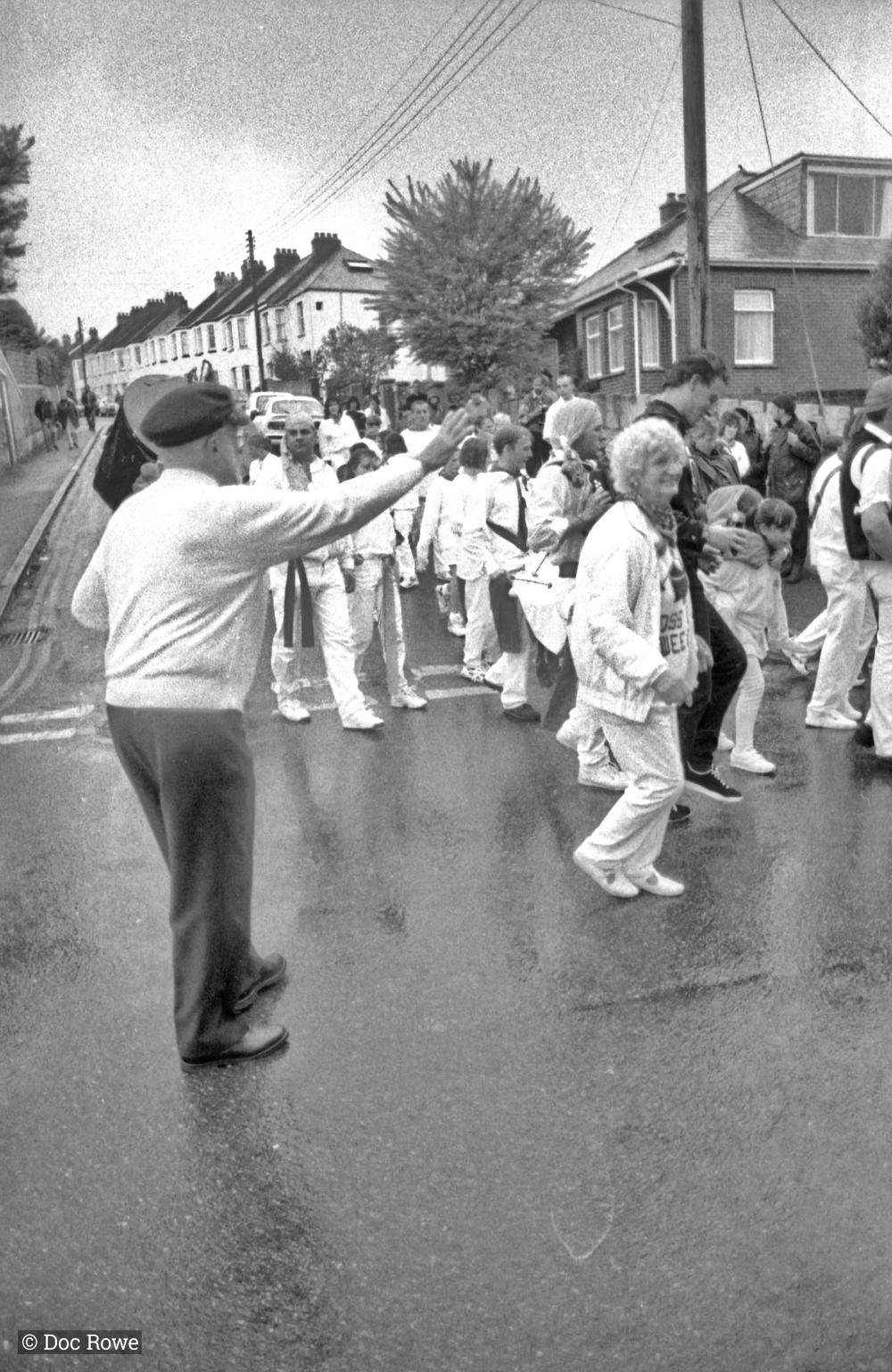 People dancing in road