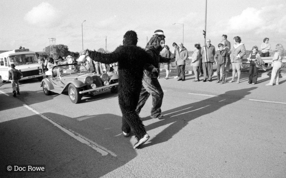 people in costumes in road