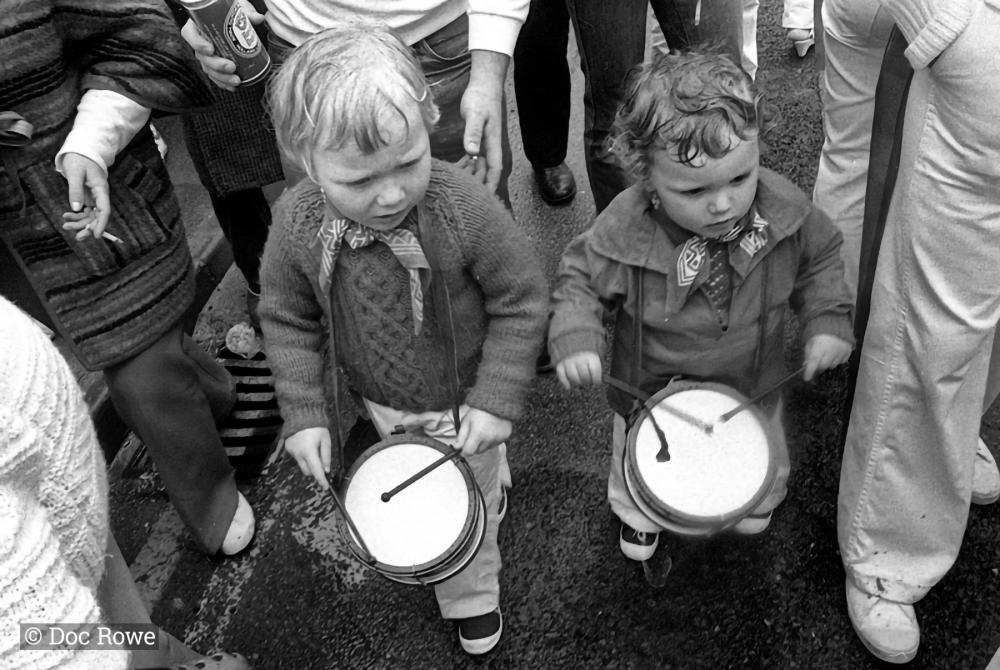 Two little children drumming
