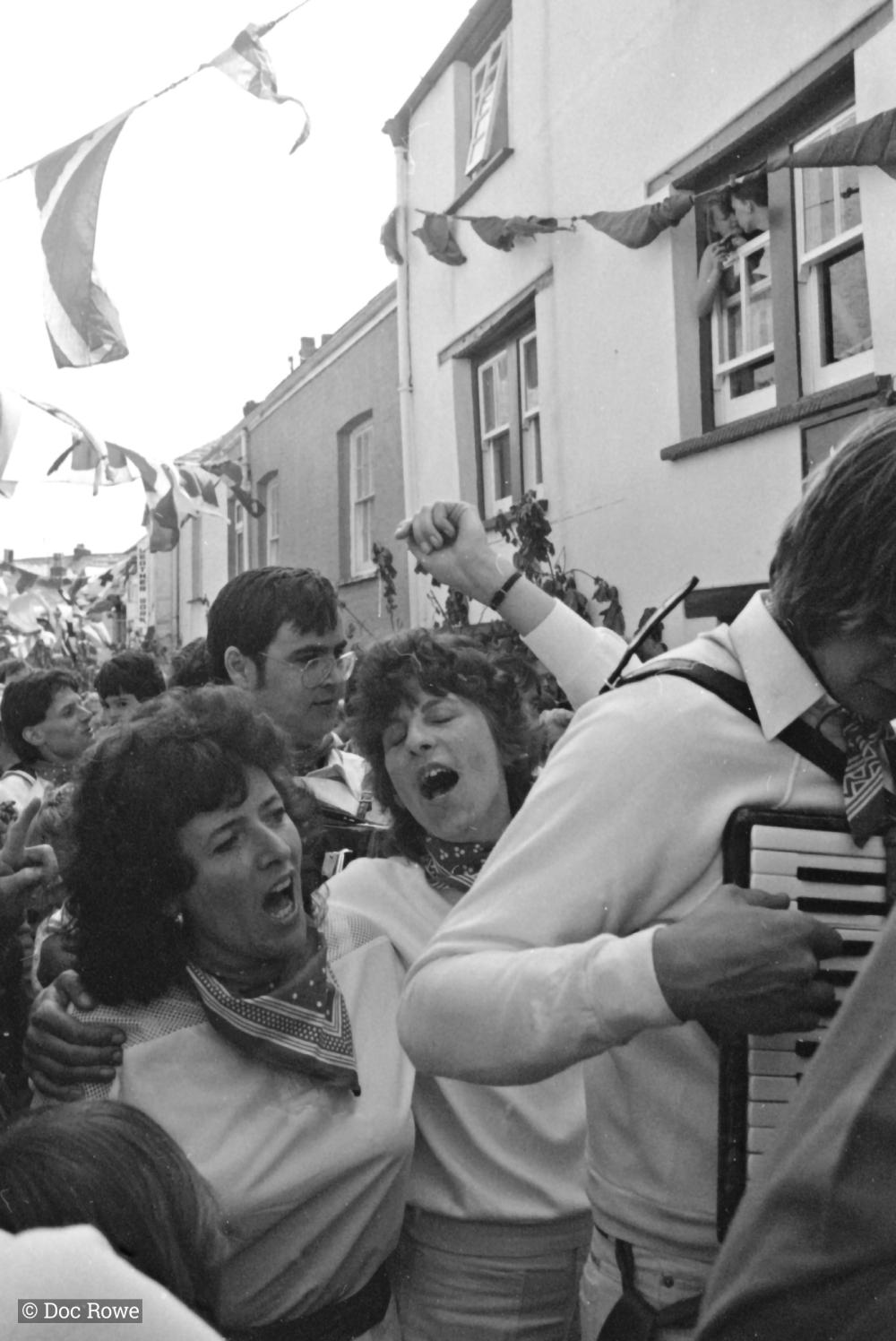 women singing in parade