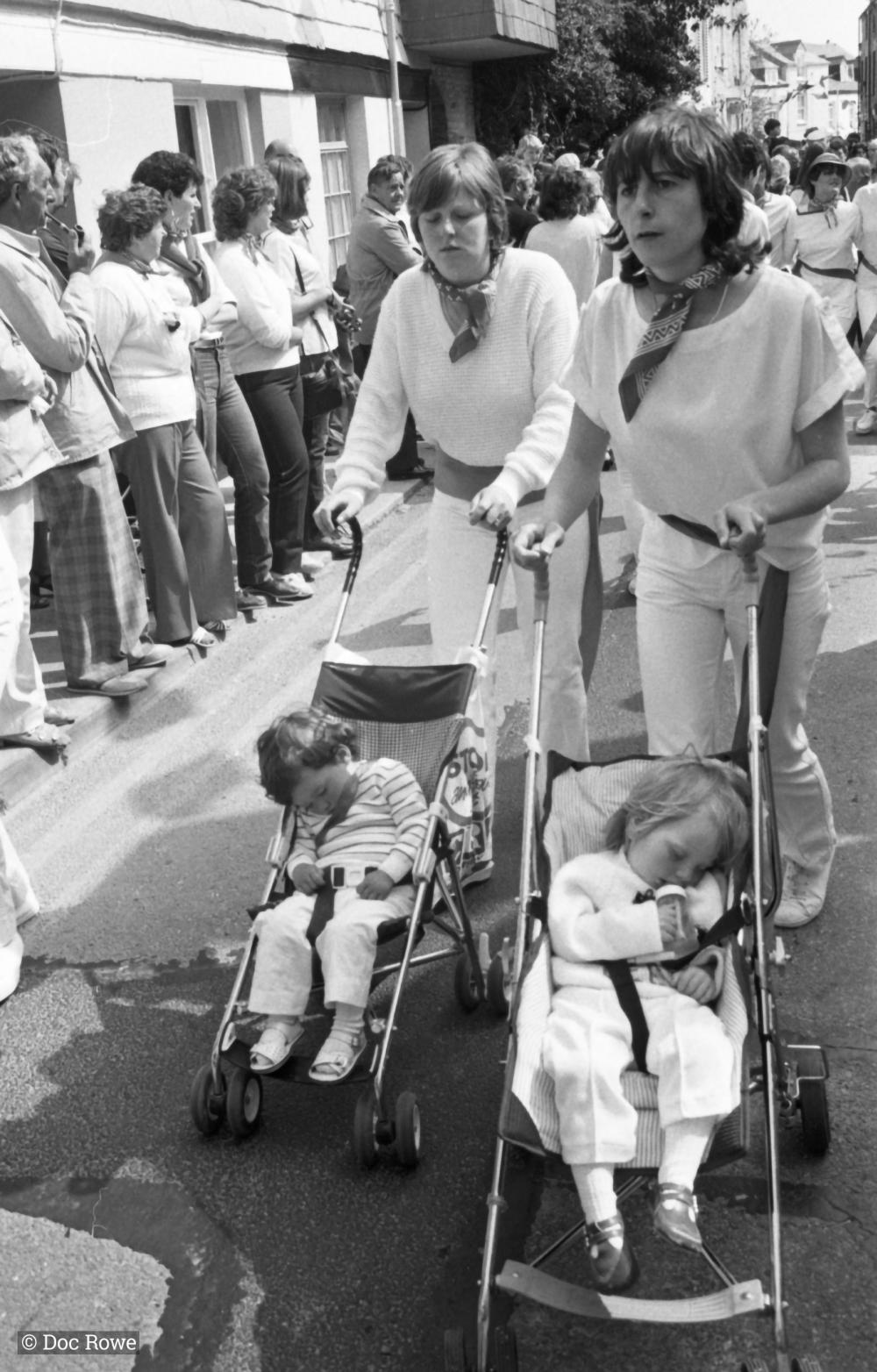 women pushing prams