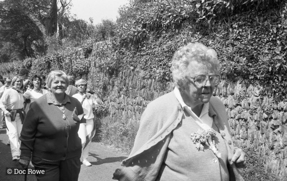 women walking in procession