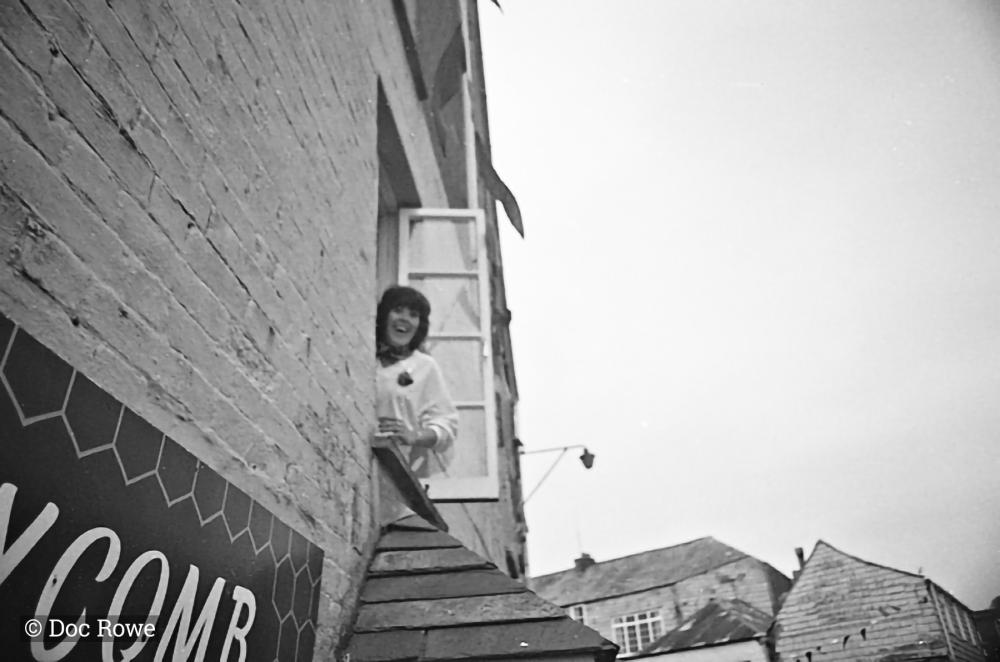 woman watching from window