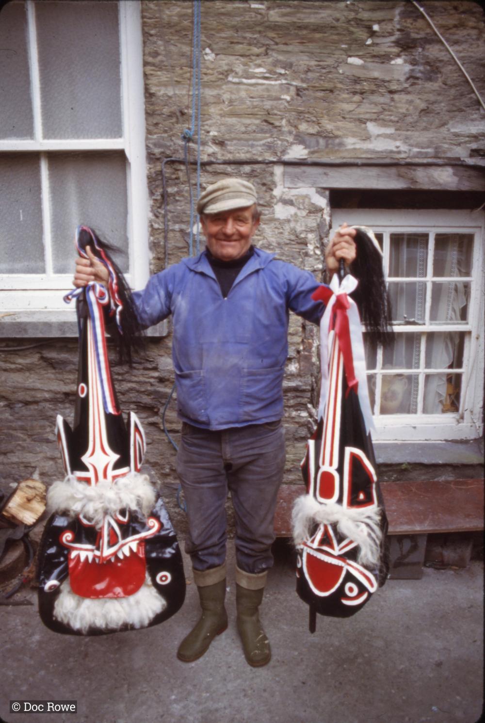 Man holding up Oss heads