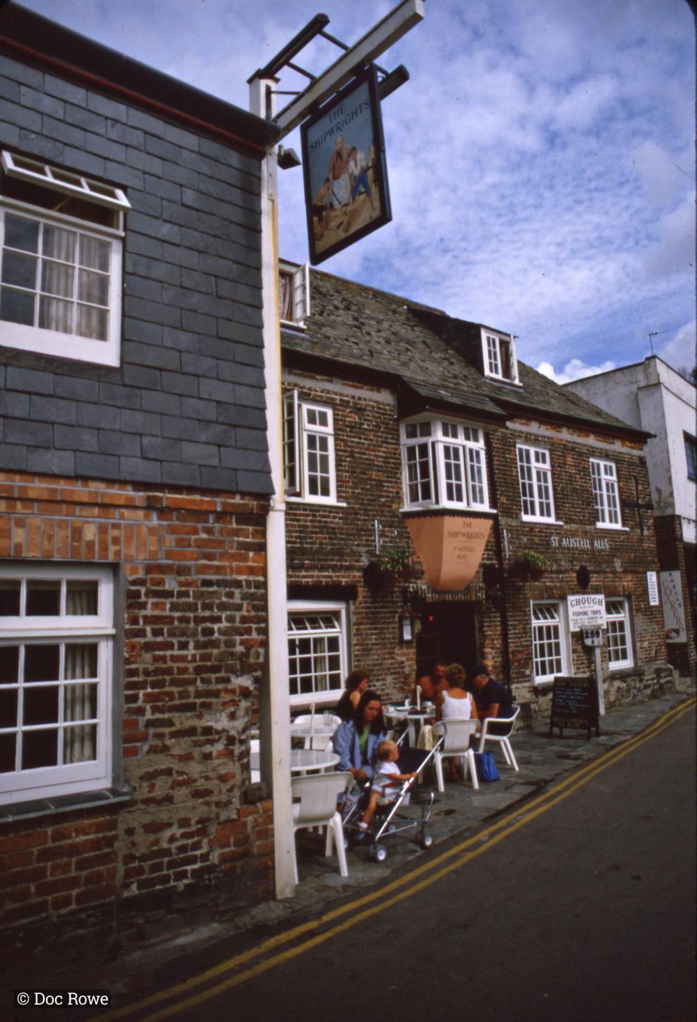 People sitting outside pub