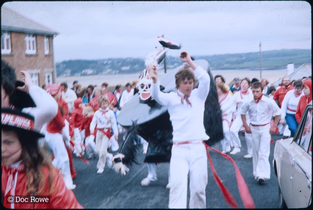 Old Oss Children's Oss, with bay in background