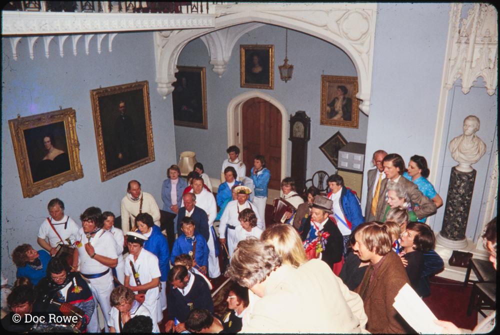 Blue Ribbon band and Master of Ceremonies in stairwell of Prideaux Place