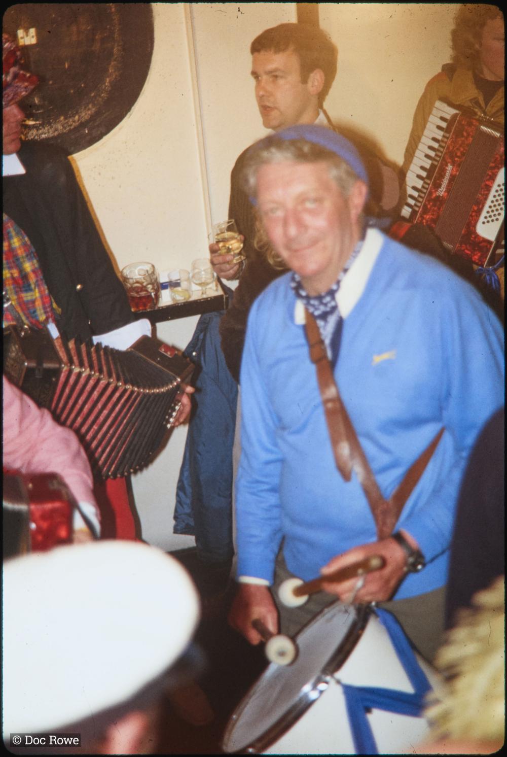 Man with drum in pub