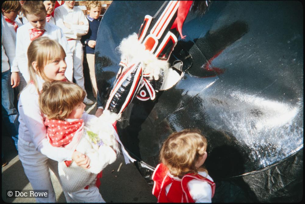 Old Oss being stroked by children