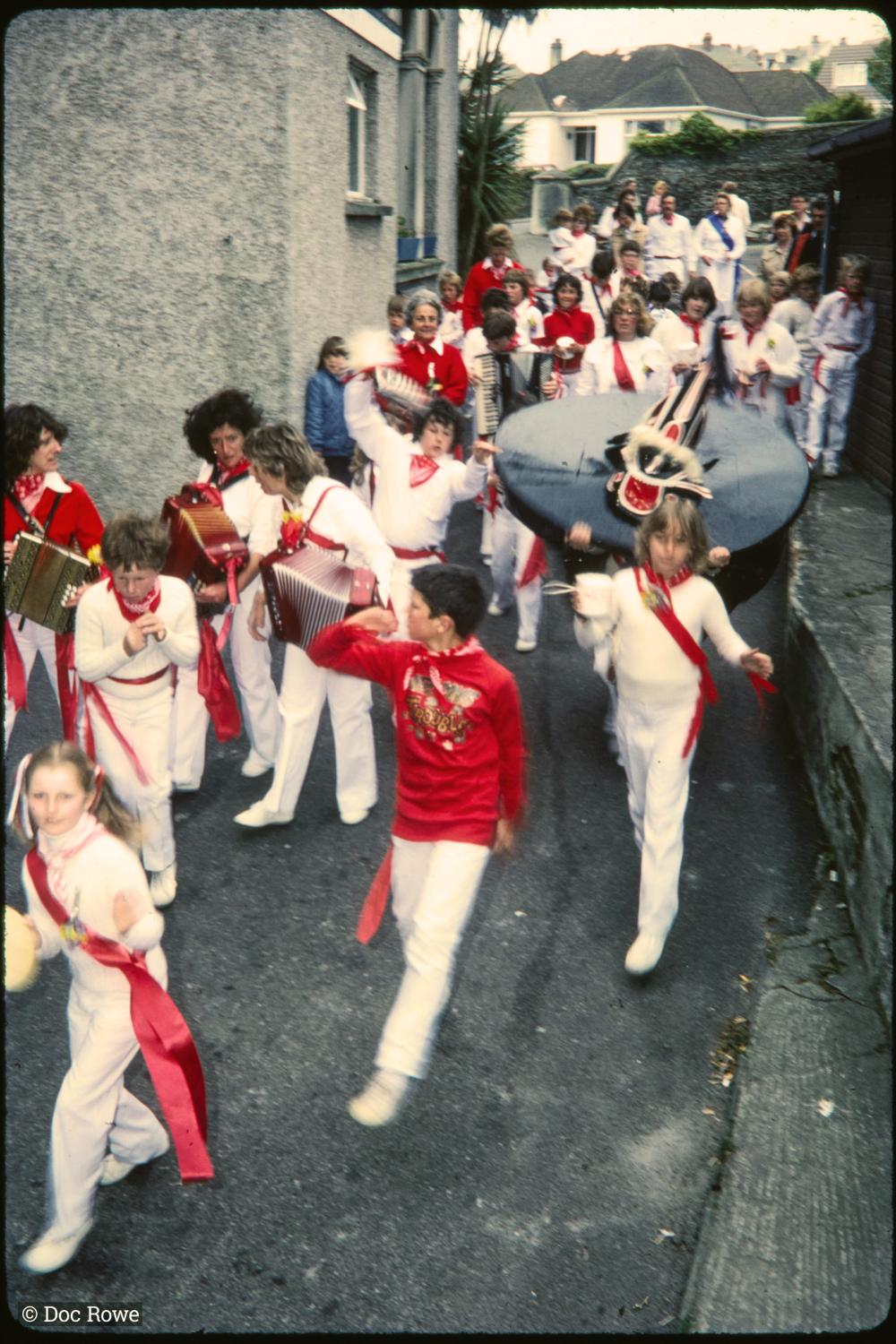 Children's Oss procession walking with Old Oss