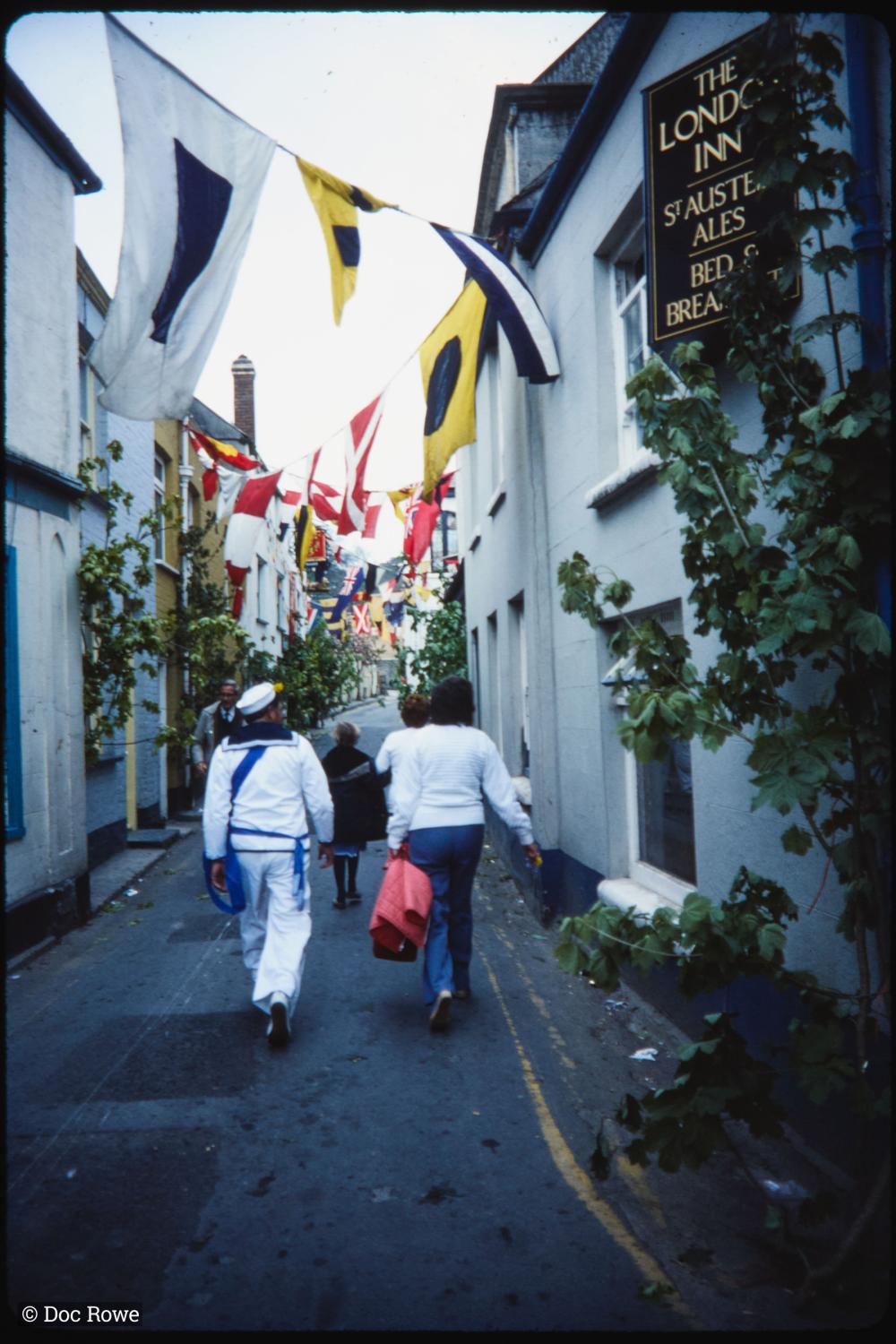 People walking up empty Lanadwell Street