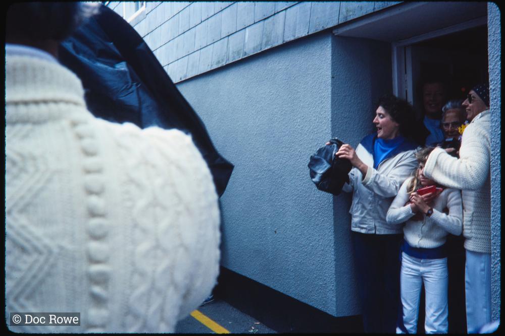 People watching from doorway