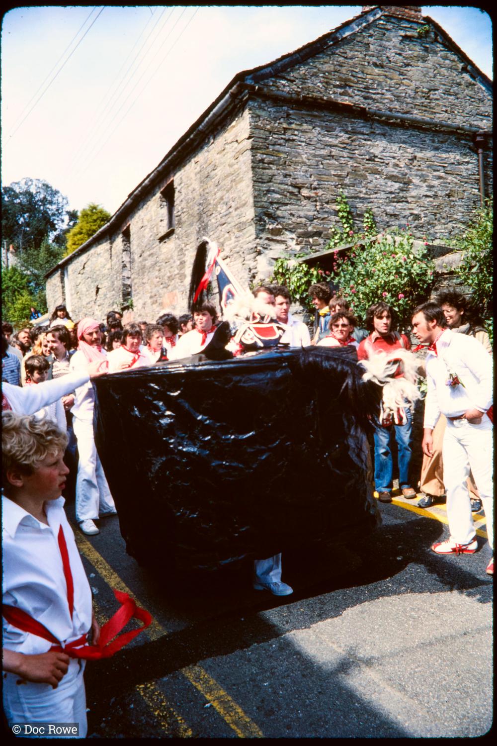 Old Oss being teased in procession