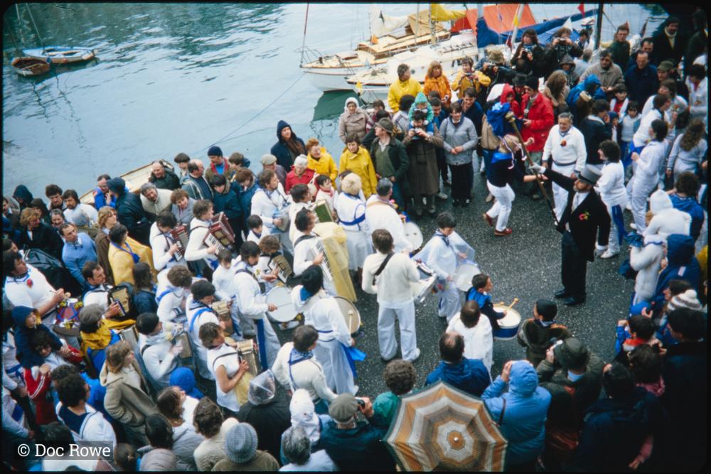 Blue Ribbon Oss dancing beside the harbour