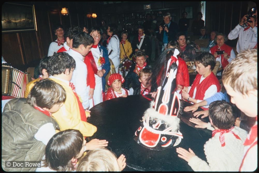 Children circled around Old Oss inside 