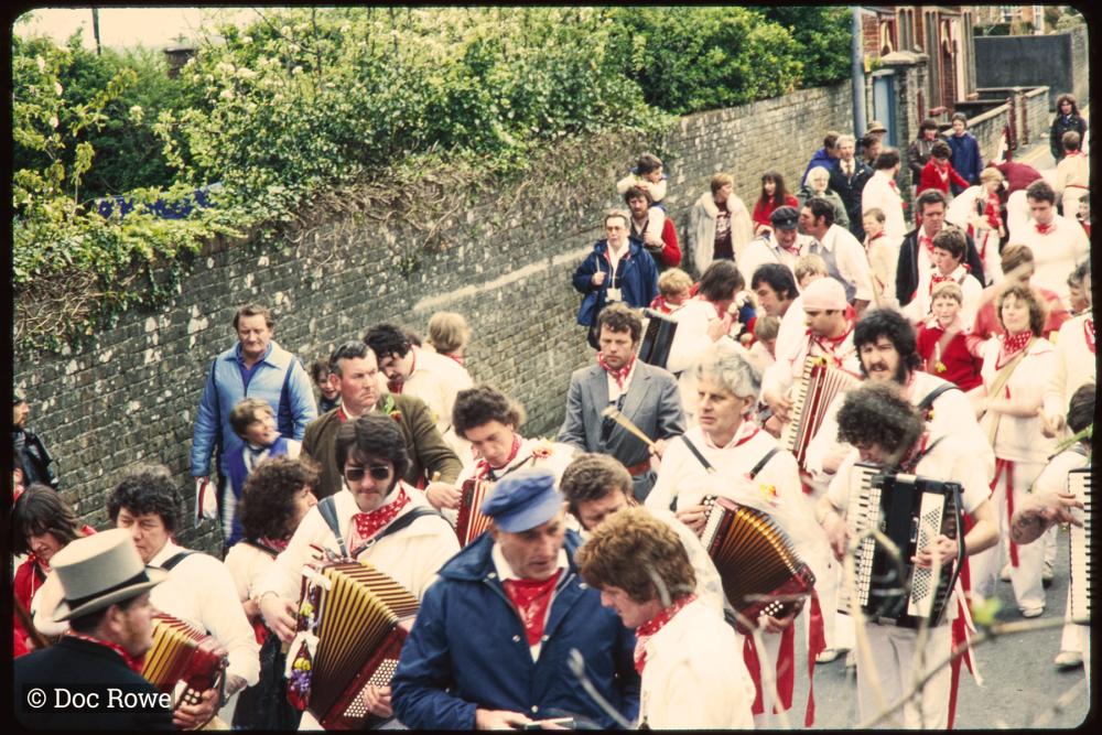 Old Oss accordion players walking in procession