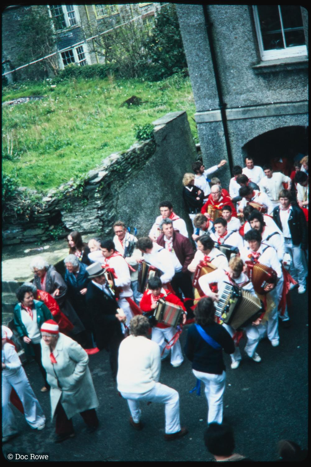 Old Oss band with master of ceremonies in alleyway
