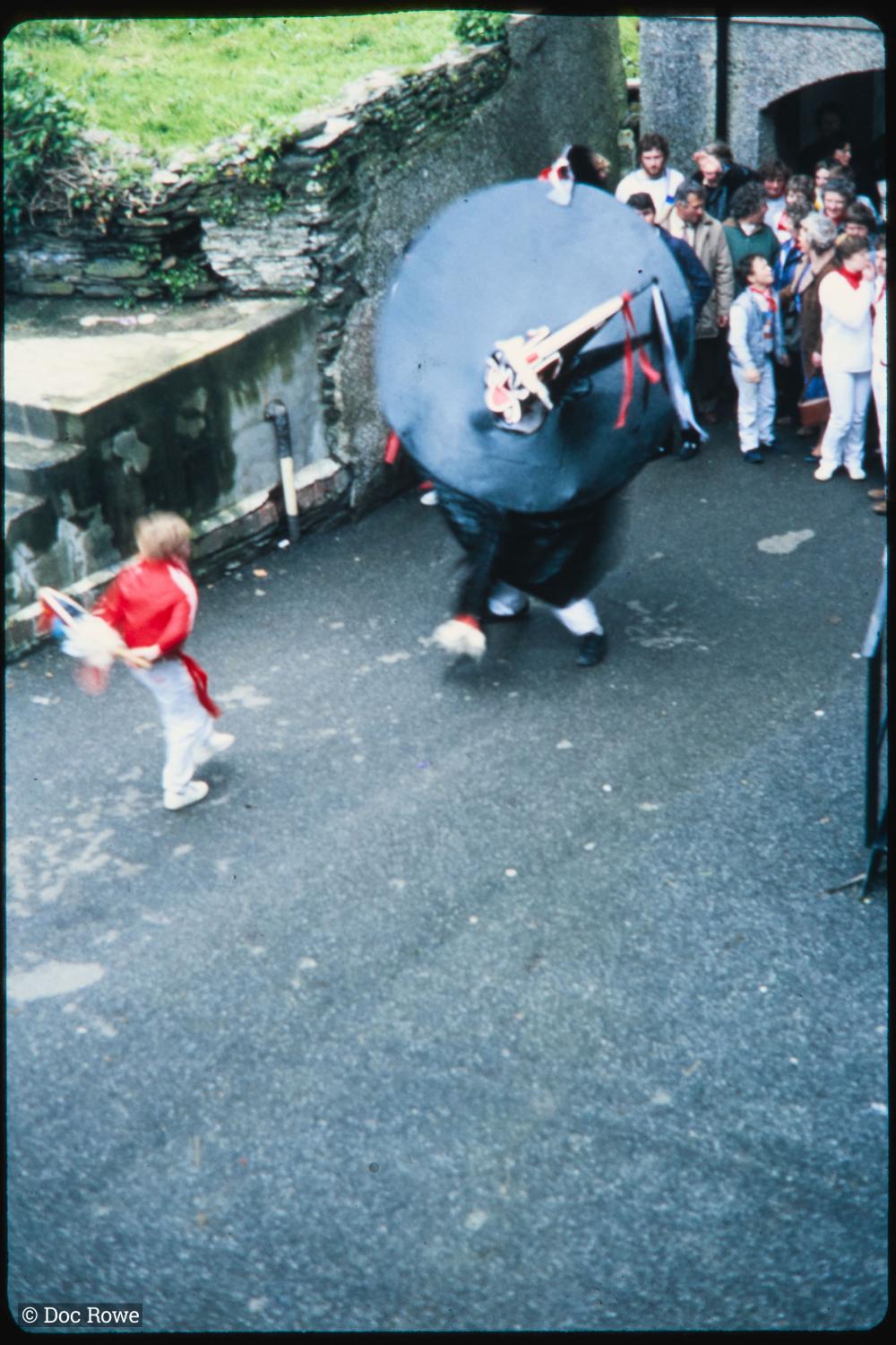 Old Oss being teased by child in alleyway