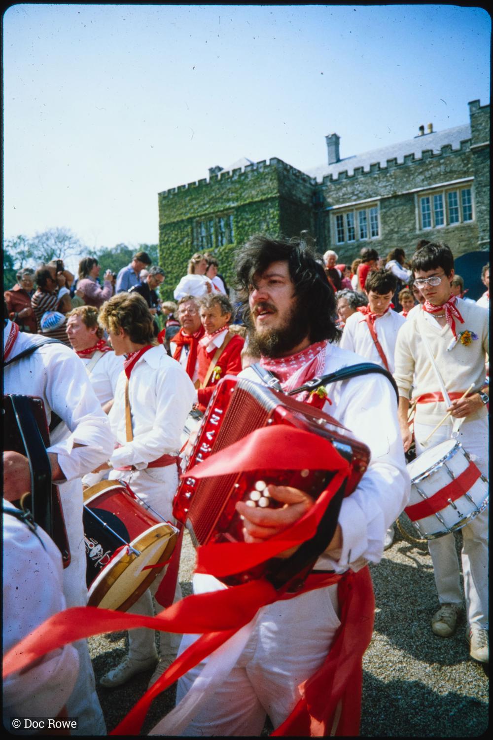 Man playing accordion outside Prideaux Place