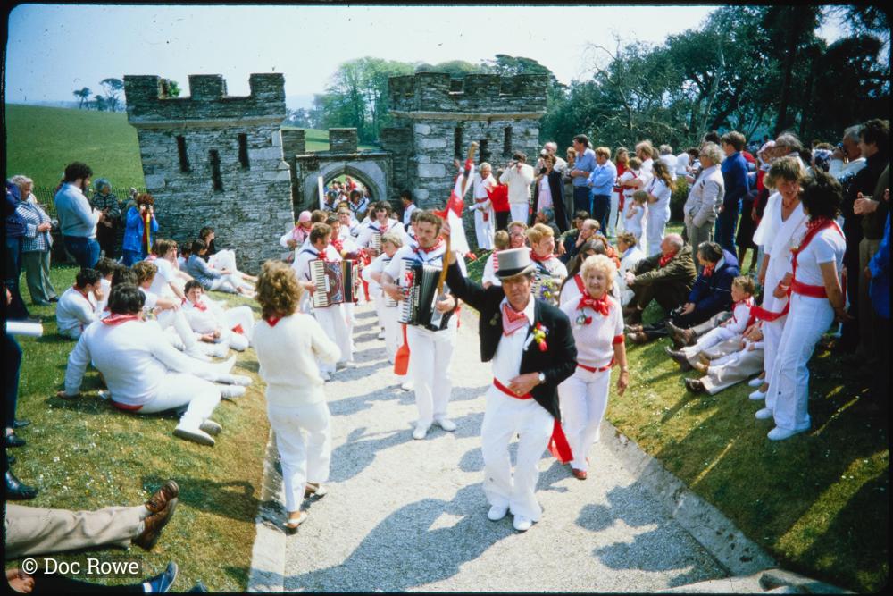 Old Oss dancers walking through Prideaux Place gate