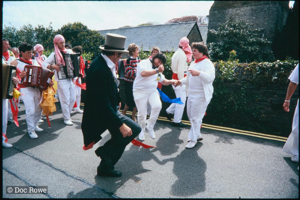 Master of Ceremonies dancing with women in procession