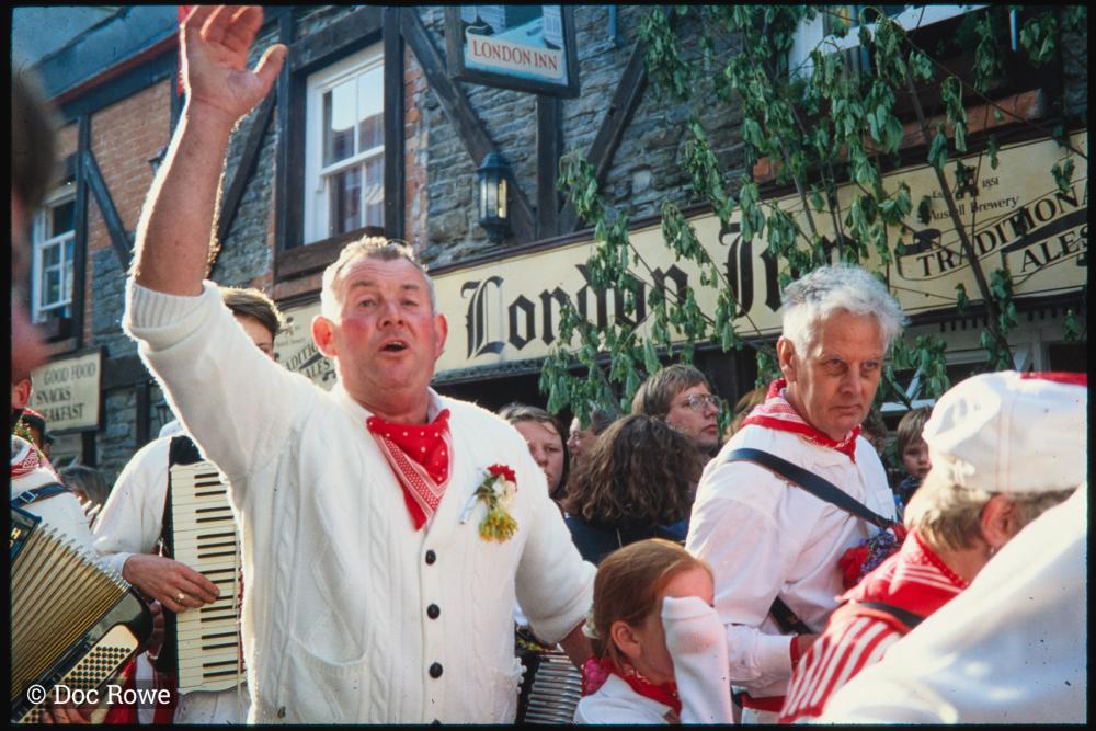Man waving in Old Oss procession