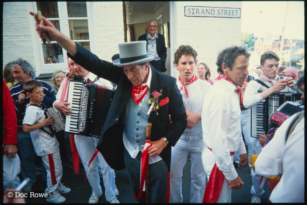 Old Oss Master of Ceremonies dancing in procession 